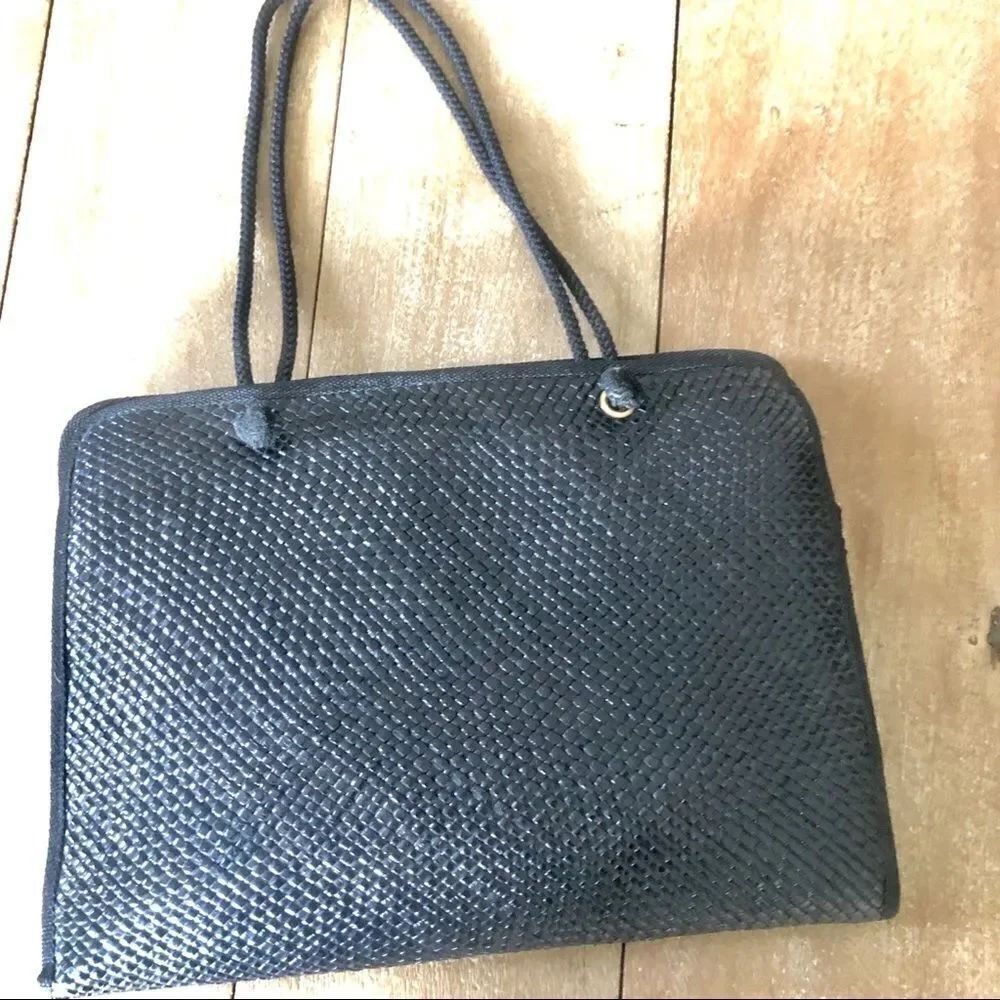 Black woven made in Italy shoulder bag.